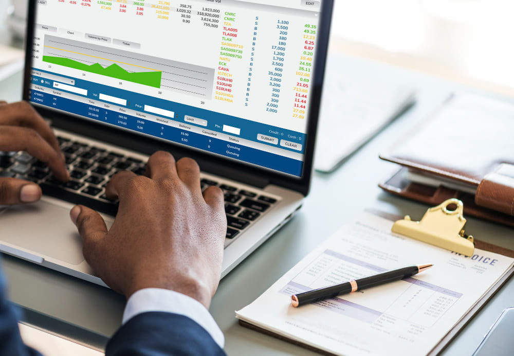 Financial documents, tax forms and a calculator on a desk