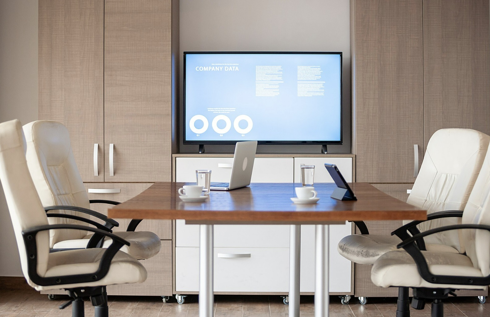 Advisory team working late in a glass-walled meeting room